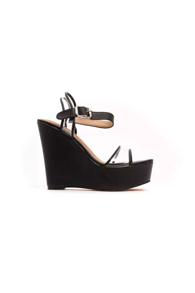 Péché Originel Plateau-Wedges in Schwarz mit transparentem Riemen