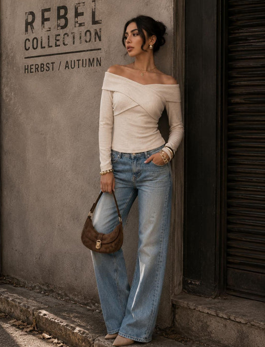 Criss-Cross Off-Shoulder Top für Damen kombiniert mit Jeans für den Herbst