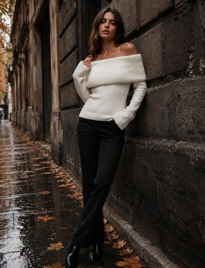 Weißer Off-Shoulder Strickpullover für Damen kombiniert mit schwarzer Hose im herbstlichen Rebel Streetstyle
